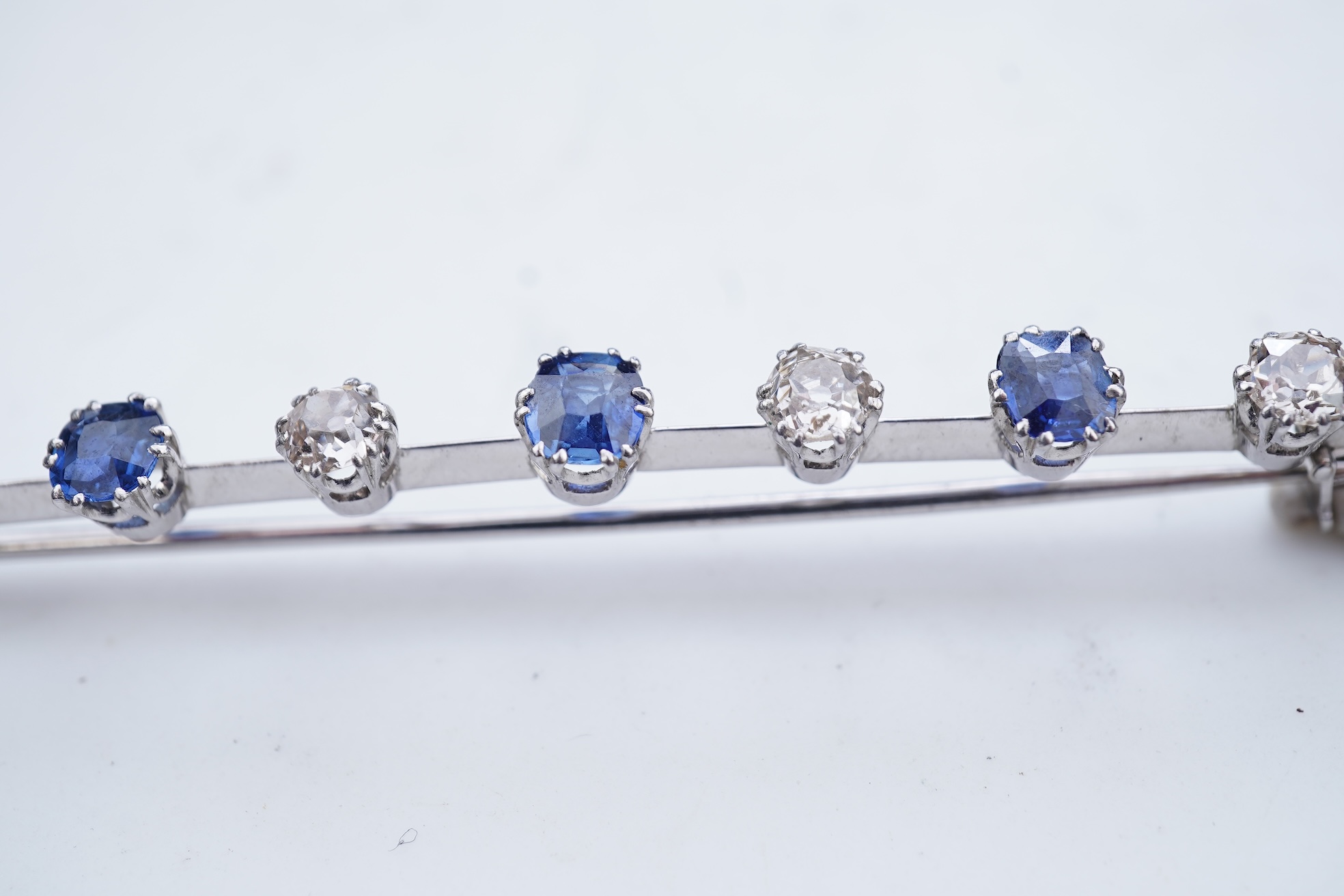 A diamond and sapphire bar brooch, early 20th century